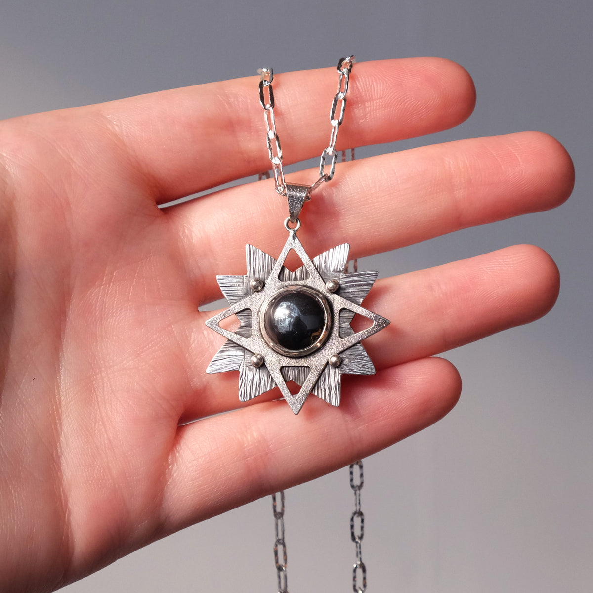 Hematite Radiant Layered Star Pendant